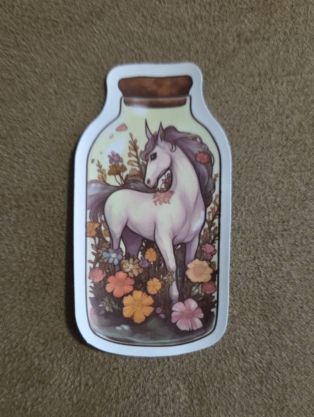 Sticker featuring a Unicorn in a Jar surrounded by Flowers